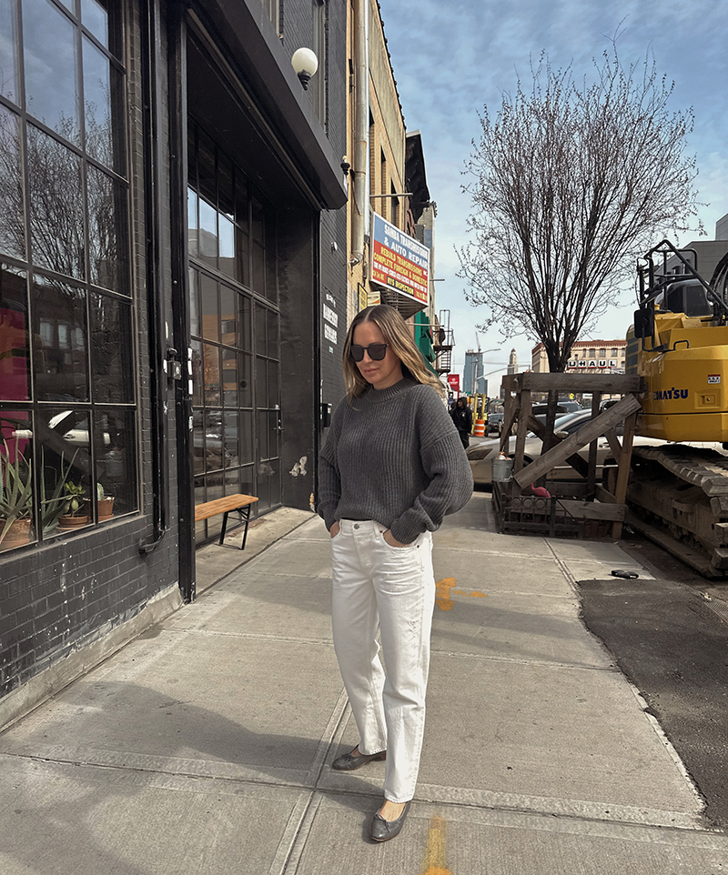 woman in grey sweater and white jeans for A Week in Outfits