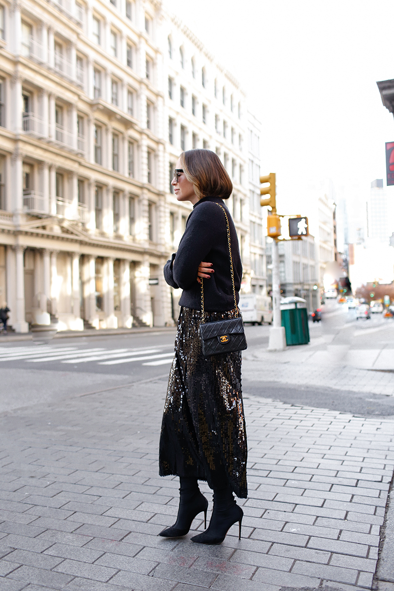woman standing and wearing All Black & Sequins skirt 